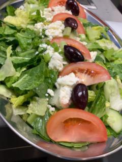 Athenian Salad · Romaine lettuce, fresh tomatoes, Kalamata olives, cucumbers, green onions, and feta cheese topped with our very own Greek dressing.