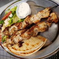 Souvlaki Plate (Skewers) · Choice of any two charbroiled all-natural chicken breast or pork loin skewers served with At...