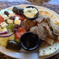 Gyro Platter · Double portion of gyro meat, warm pita, tzatziki, and dolmades. Comes with a small Greek sal...