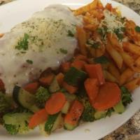 Veal Parmigiana · Breaded veal with marinara sauce and mozzarella cheese. Served with vegetables, pasta, bread...