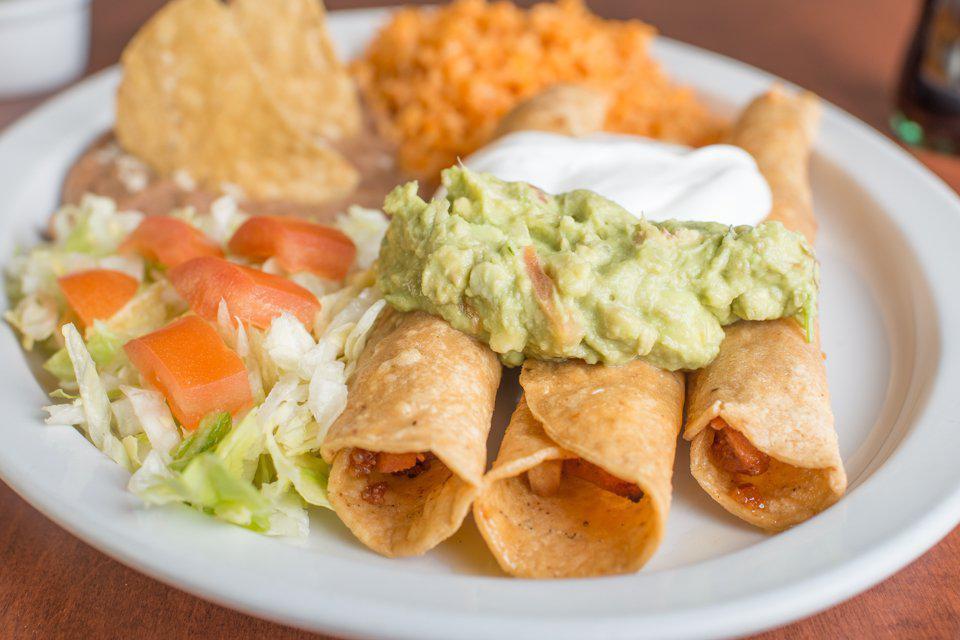 Flauta Plate · Three flute-shaped tacos filled with chicken and cheese, served with rice, beans, lettuce, tomato, sour cream and guacamole.

Cheese can not be removed from Flautas, sorry.