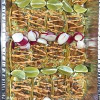 Shrimp Taco (a' la carte) · On corn tortilla, sour cream, lettuce, pico de gallo, topped with chipotle salsa.