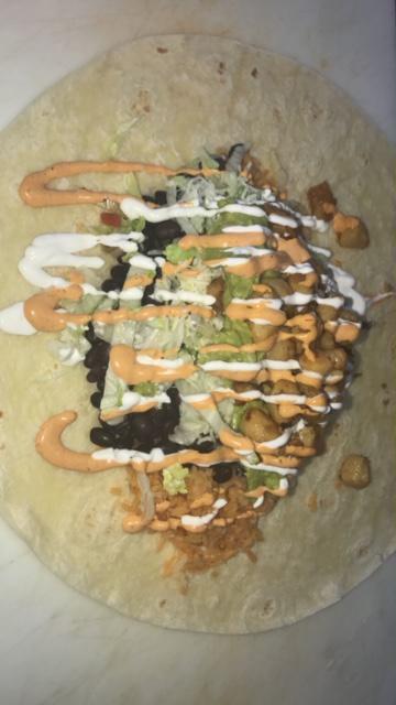 Fish Burrito · Fish, rice, black beans, lettuce, sour cream, jack cheese and pico de gallo topped with chipotle salsa.