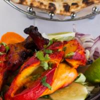 Tandoori Chicken a la Carte · Chicken marinated in yogurt with special gerb and spices. Served with naan bread.
