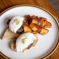 Steak & Eggs Benedict · grilled tenderloin, poached eggs with huancaina sauce on toasted English muffin and home fries
