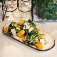 Grilled Caesar Salad · grilled baby romaine, our Caesar dressing, paprika croutons, shaved parmesan