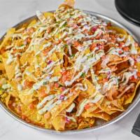 Street Corn Nachos · Corn tortilla chips smothered with homemade nacho cheese, shredded lettuce, fresh pico de ga...