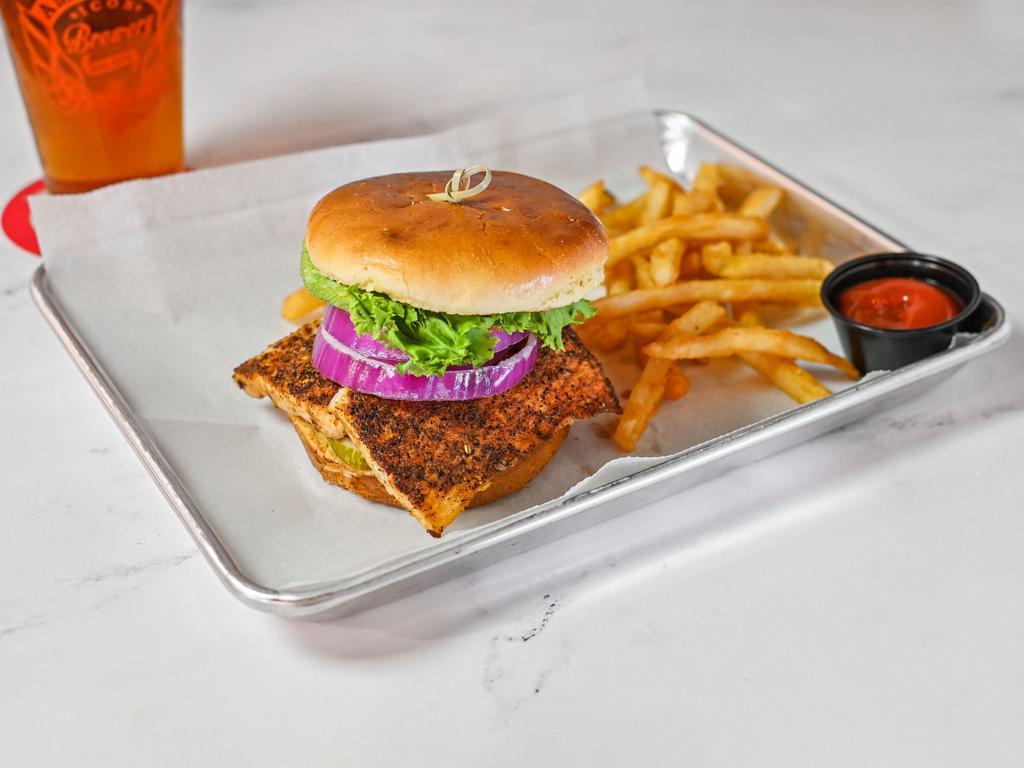 Mahi Sandwich · A blackened mahi filet cooked to perfection with lettuce, tomato, onion, and pickles, and topped with rémoulade sauce on a brioche bun.