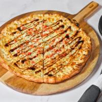 White Pizza · Hand tossed and topped with seasoned ricotta, roasted garlic,
tomatoes, mozzarella, parmesan...
