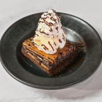 The Duke · A large ghirardelli double chocolate brownie served warm and topped with a scoop of vanilla ...