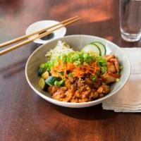 The Seoul Heat Bowl · Spicy chicken over rice base, with kimchi, pickled cucumber, prepared zucchini, carrots, and...