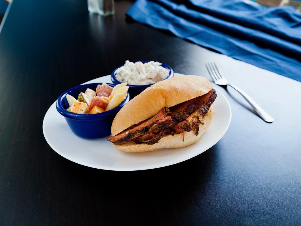 Tri-Tip Sandwich · Smoked for 8 hours using our signature mop sauce, our tri-tip has excellent flavor. Hand sliced for a tender bite. Served on a roll with a side of salsa and BBQ sauce.