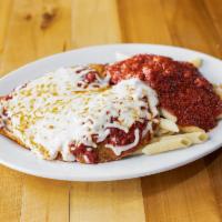 Chicken Parm · A portion of breaded chicken cutlet topped with homemade marinara sauce and mozzarella chees...