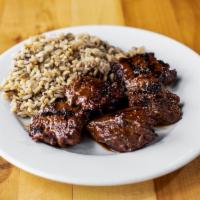 Steak Tips · Tender cuts of steak marinated in recipe. Served with a side and salad.