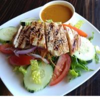 Smile Thai Salad · Grilled marinated chicken over salad, cucumber and tomato; serve with house yolk dressing or...