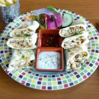 Chicken Shawarma Wrap · Served with fries, sauce and pickles on the side.