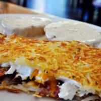 The Hangover · Stuffed hash browns and homemade biscuit covered with country sausage gravy.