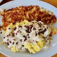 Chicken and Biscuits · Fried Chicken, bacon, scrambled eggs and country sausage gravy on biscuits served with hash ...