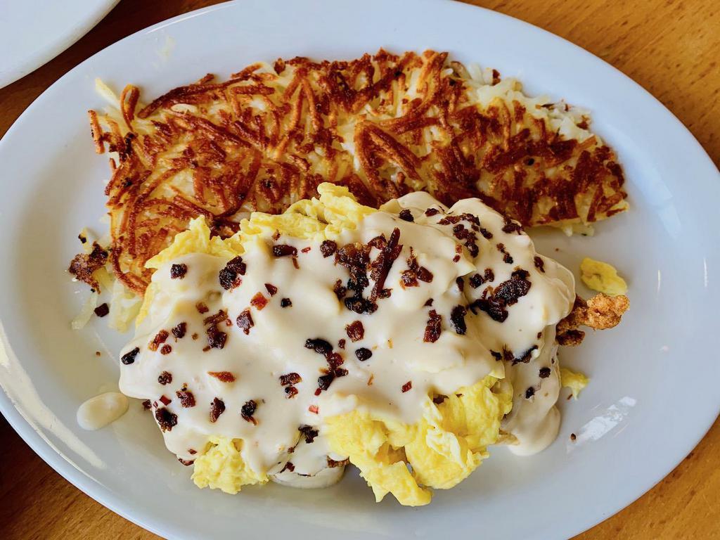 Chicken and Biscuits · Fried Chicken, bacon, scrambled eggs and country sausage gravy on biscuits served with hash browns or potatoes.