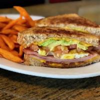 The Breakfast Club · Ham, bacon, avocado, fried egg, tomato and cheddar on grilled bread served with country pota...