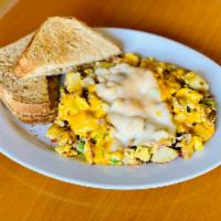 Mama’s Scrambler · Sausage, ham, onions, bell peppers, tomatoes, eggs, country potatoes, jack and cheddar serve...