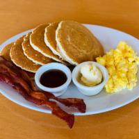 Griddle Combo · Choice of pancakes, French toast or waffle served with 2 eggs and 2 strips of bacon or sausa...