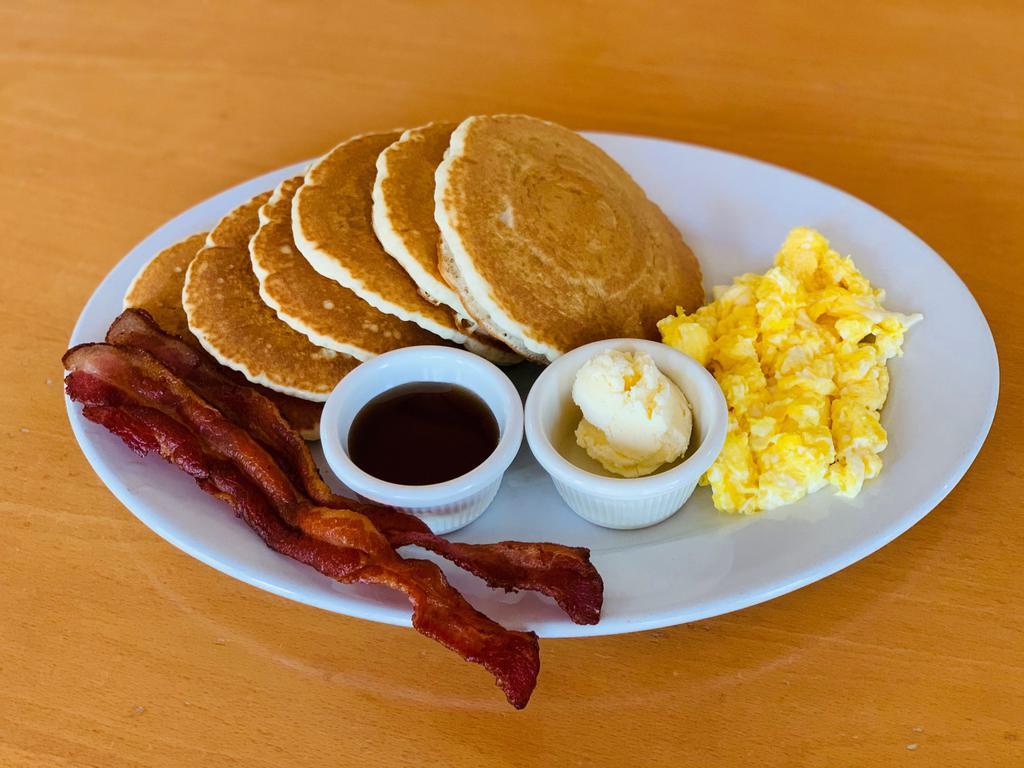Griddle Combo · Choice of pancakes, French toast or waffle served with 2 eggs and 2 strips of bacon or sausage links.