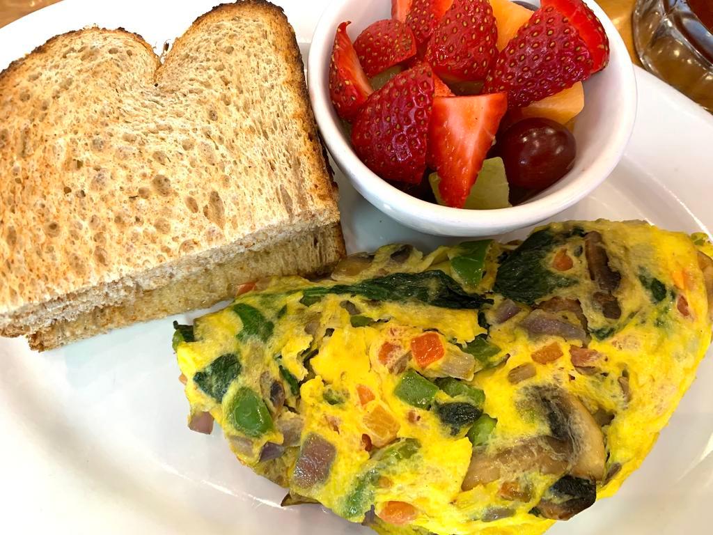 Veggie Omelet · Spinach, mushrooms, bell peppers, onions and tomatoes.