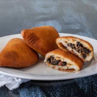 Pabellón empanada · Empanada with beans, beef, cheese, and sweet plantains filling