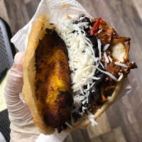Pabellon Arepa (1) · Arepa filled with beef, black beans, cheese and sweet plantain