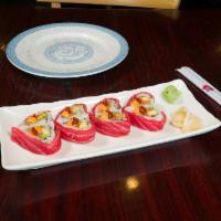 M10. Sweetheart Maki · A heart shape roll with spicy tuna and avocado topped with fresh tuna, sirracha sauce and sp...