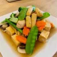  8. Vegetable Delight  · Deep fried tofu stir-fried with broccoli, carrot, snow peas,  mushrooms and baby corn in lig...