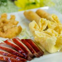 Appetizer Plate · Served with (8pc) BBQ pork, (2pc) spring roll, (4pc) crab puffs and (4pc) fried shrimp.
