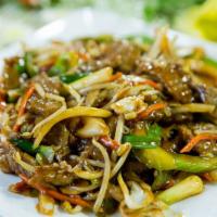 Mongolian Beef · Sliced beef sauteed with green onions, peppers, bean sprouts, cabbage and carrots in a house...