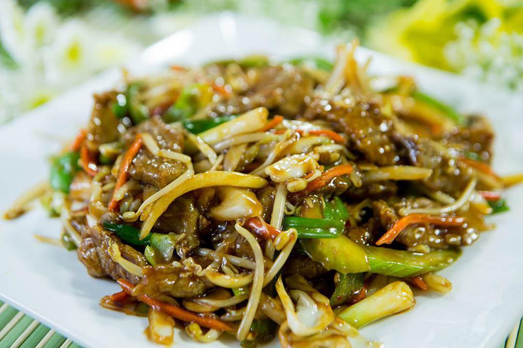 Mongolian Beef · Sliced beef sauteed with green onions, peppers, bean sprouts, cabbage and carrots in a house made brown sauce. Hot and spicy. Served with steamed rice.