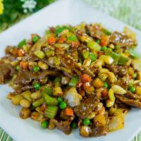 Kung Pao Beef · Tender beef stir fried with fresh onions, green peppers, carrots and peanuts in spicy sauce....