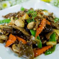 Beef with Black Mushrooms · Sliced beef stir fried with mushrooms, onions, peanods and black mushroom in brown rice.