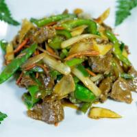 Beef with Oyster Sauce · Tender beef sauteed with peanuts, greens and white onions in oyster sauce. Served with steam...
