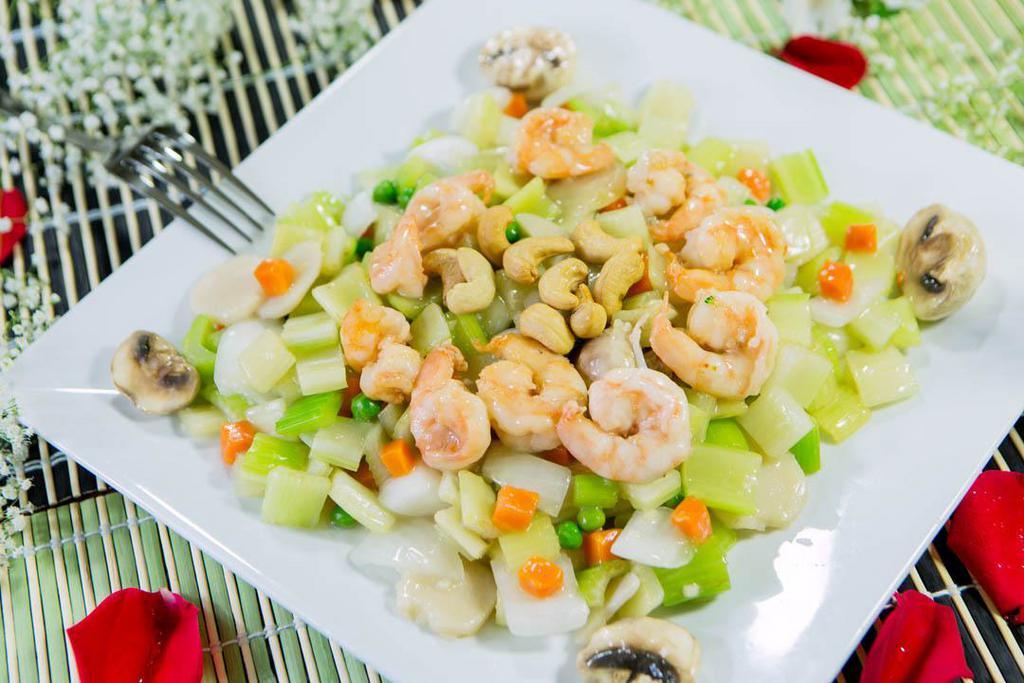 Cashew Nut Shrimp · Shrimp stir fried with fresh celery, mushrooms, water chestnuts, onions, peas, carrots and topped with cashew nuts. Served with steamed rice.