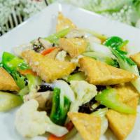 Buddhist Delight · Deep fried tofu, broccoli, celery and mushrooms. Served with steamed rice. Vegetarian.