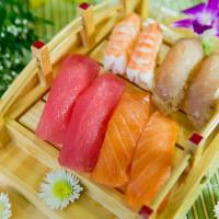 Medium Sushi Boat for 2 · 8 pieces California roll, 5 pieces Spicy Tuna roll, 8 pieces Long Island roll, 2 pieces salm...