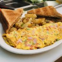 Western Omelette · Served with french fries, home fries or hash brown and white or wheat toast. 