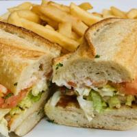 Grilled Chicken Sandwich · With lettuce, tomatoes, mayonasse & French Fries.