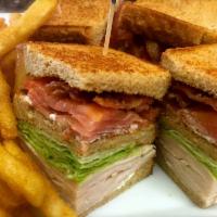 Turkey Club Sandwich · Served with french fries. 