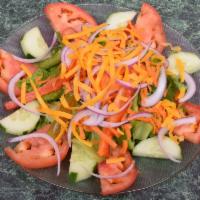 Garden Salad · Lettuce, cucumbers, tomatoes, green peppers, onion, carrot and shredded cheddar cheese.