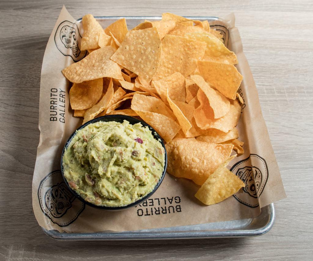 Chips & Guac · Fresh Avocado, Garlic, Onion, topped with Diced Tomato, Red Onion, Queso Fresco, and Chopped Cilantro