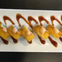 Mango Tree Roll · Avocado and tempura shrimp topped with crab meat and mango with spicy mayo, and eel sauce.