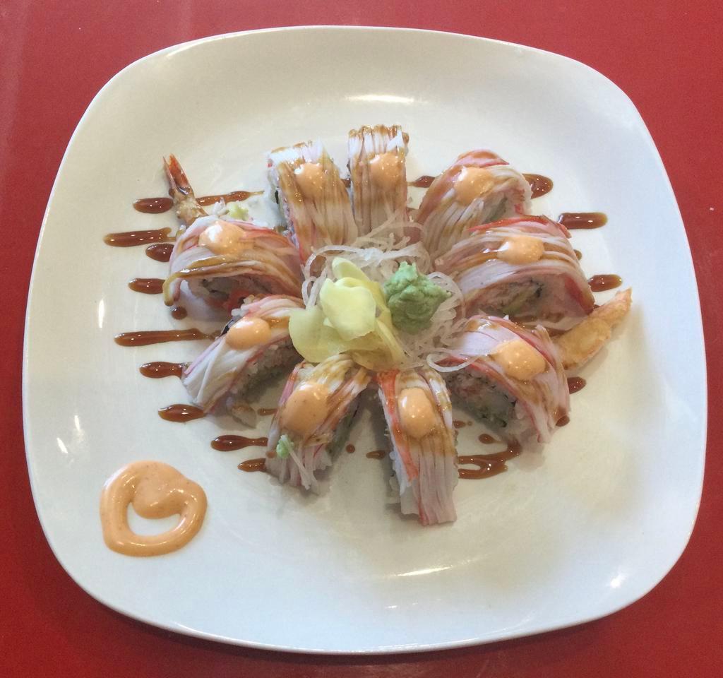 Sunrise Roll · Tempura shrimp, avocado, and crab meat topped crab stick with spicy mayo, and eel sauce.