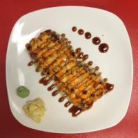 Baked Scallop Roll · Shrimp tempura and avocado topped with spicy tuna scallop with eel sauce.