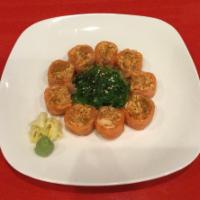 Happy Salmon Roll · Spicy crab meat wrapped in salmon surrounding seaweed salad with ponzu sauce.